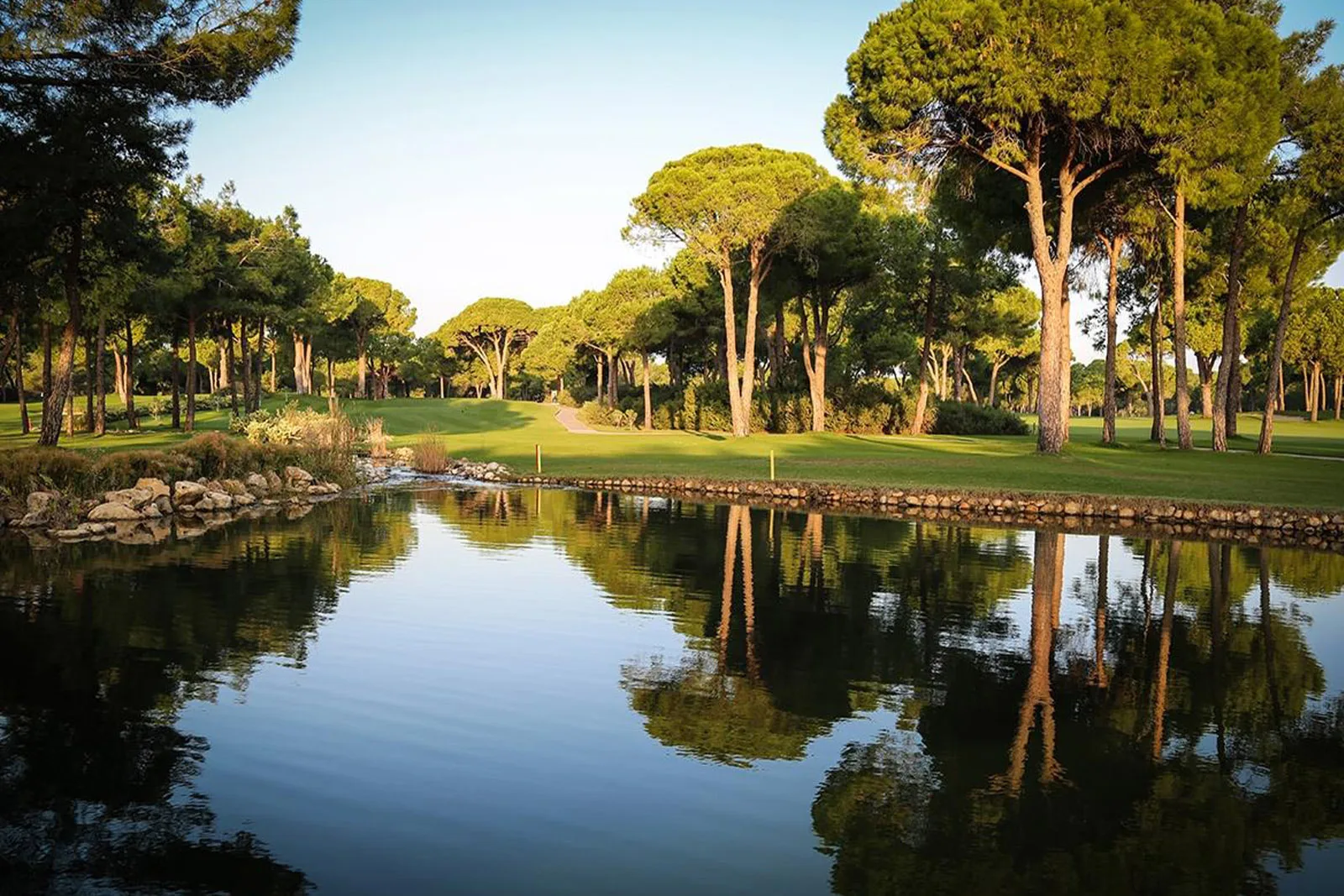 Reflective water and fairway at Robinson Nobilis Golf Club