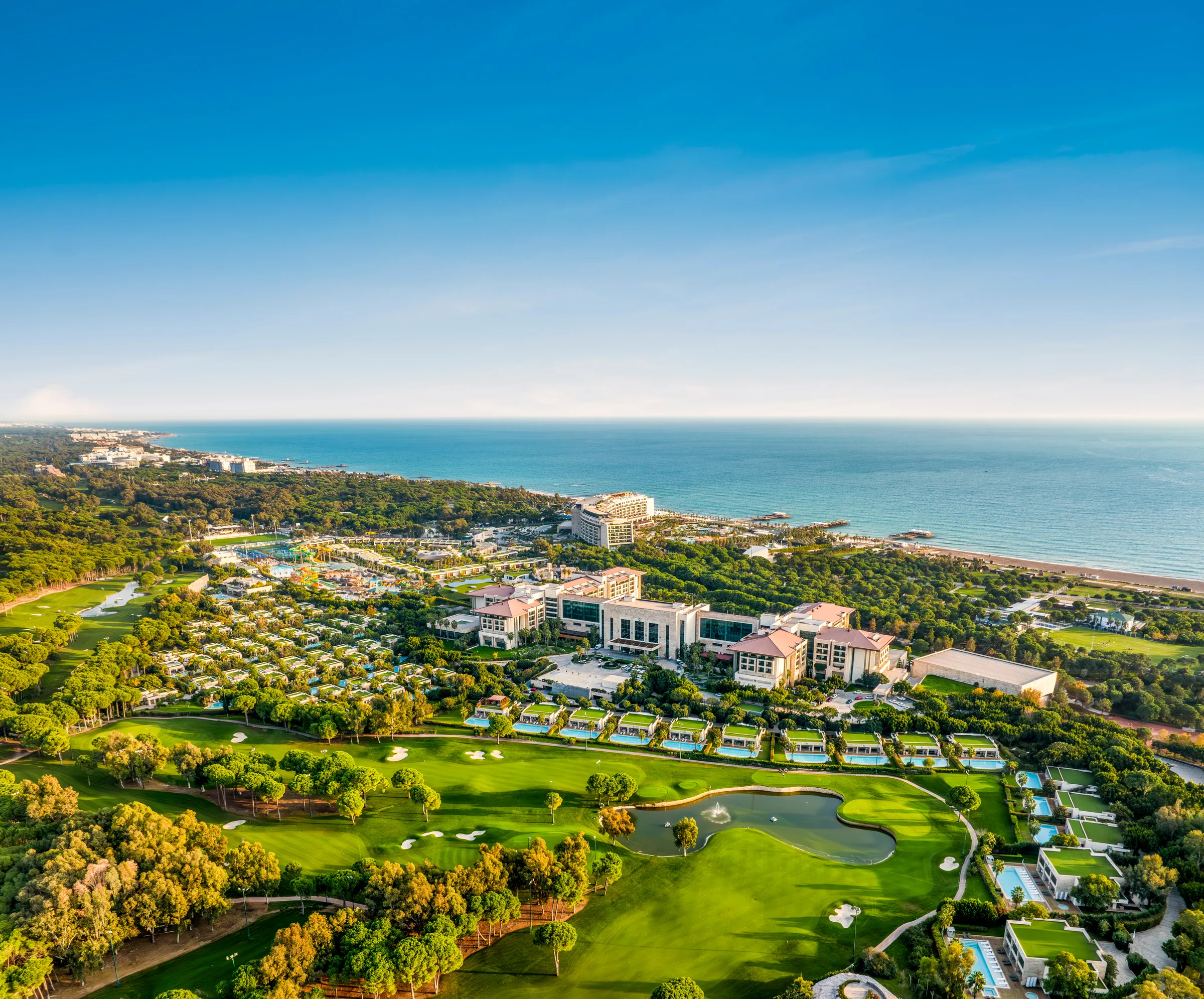 Aerial view of Regnum Carya between the golf landscape and coast